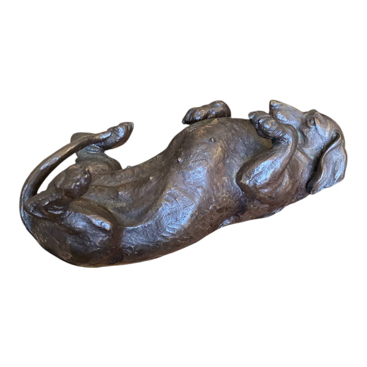 DORIS LINDNER "Rolling Dachshund" - Bronze coated resin sculpture.
