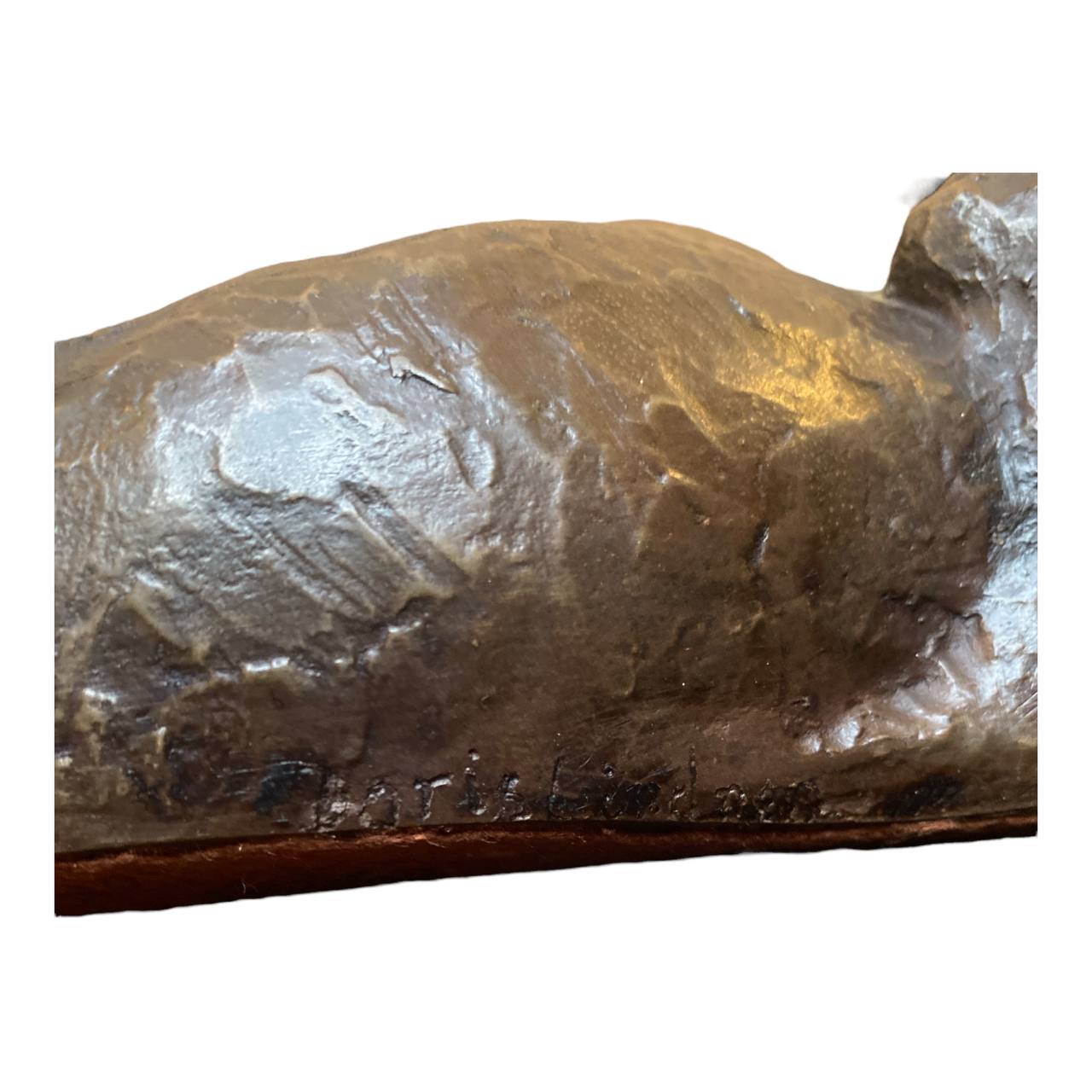 DORIS LINDNER "Rolling Dachshund" - Bronze coated resin sculpture.