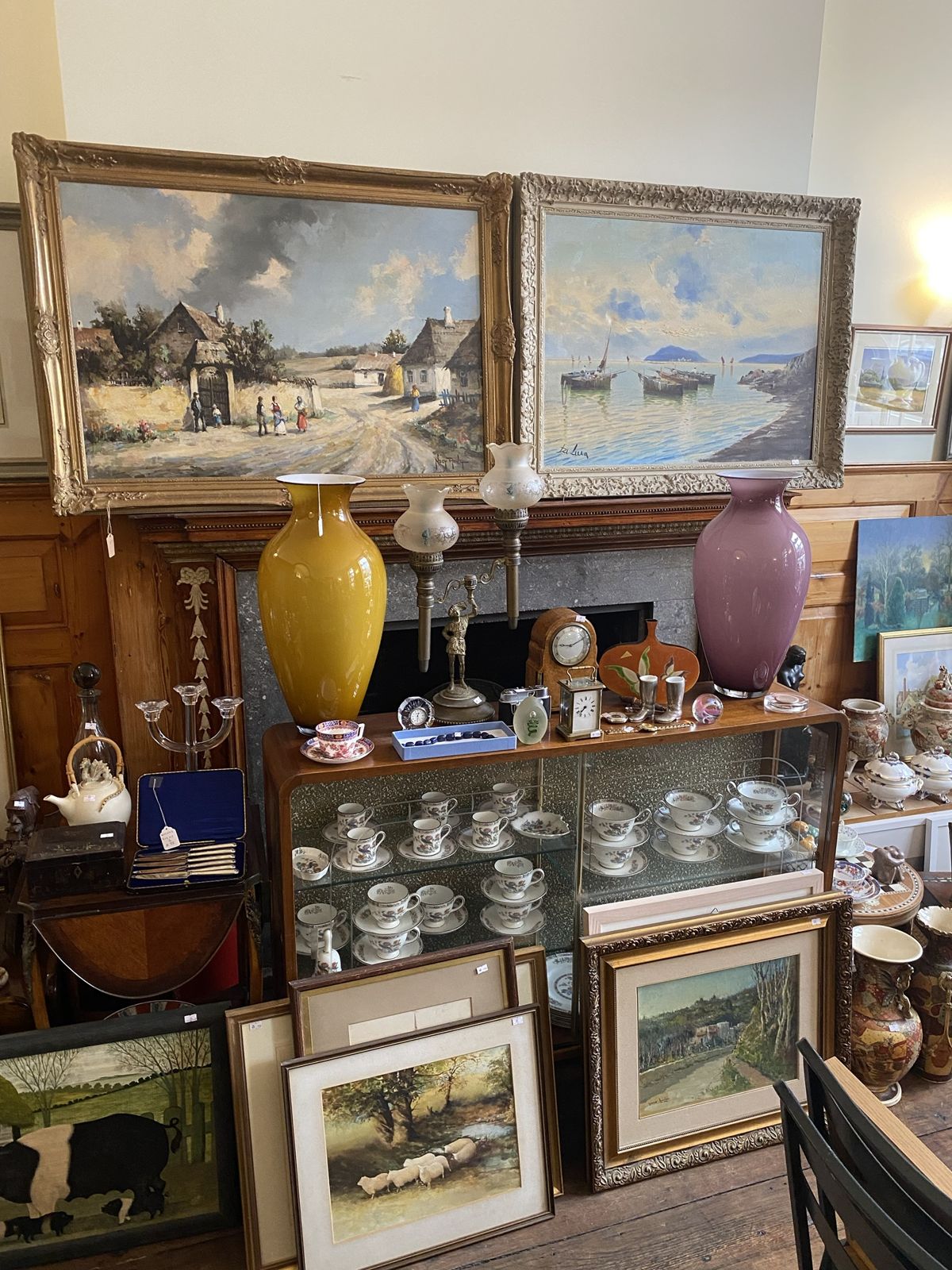 Paintings, glass and clocks inside the CharmChase shop